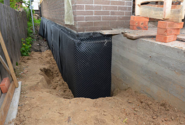 Happy homeowners after waterproofing job in Mulberry
